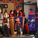The All Nations Children dance group prepare to perform a song during the Elizabeth Peratrovich Day celebration at the Tlingit and Haida Community Council on Sunday. (Michael S. Lockett | Juneau Empire)