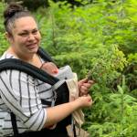 photos by Vivian Faith Prescott | For the Capital City Weekly                                 Nikka Mork carries her son, James Mitchell, as she picks blueberries during summer.