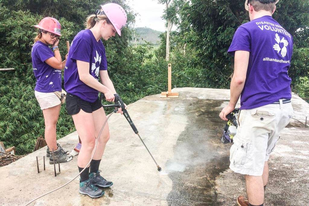 Volunteers with All Hands and Hearts, a charitable nonprofit, help to clear some of the devastation in Puerto Rico following Hurricane Maria in March 2018. (Courtesy Photo | Fred Hiltner)
