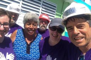 Volunteers with All Hands and Hearts, including Fred Hiltner, far right, take a photo with a homeowner they were helping in Puerto Rico following Hurricane Maria in March 2018. (Courtesy Photo | Fred Hiltner)