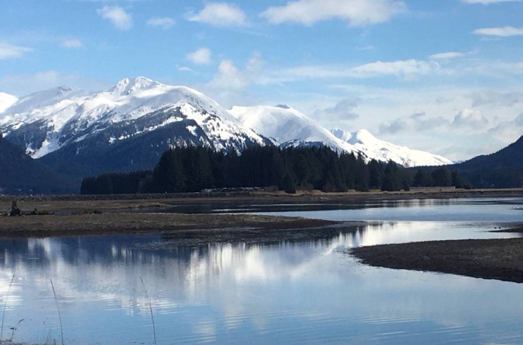 The west and middle peaks of Mount Juneau and Mount Roberts reflect on Mendenhall River on Sunday, March 22, 2020. (Courtesy Photo | Denise Carroll)