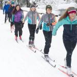 Juneau Nordic Ski Team members Erin Wallace, front, leads Aaron Blust and Anna Iverson in a pole-less skiing drill through fresh snow on Saturday, Nov. 18, 2017, at the Mendenhall Campgrounds. (Nolin Ainsworth | Juneau Empire File)
