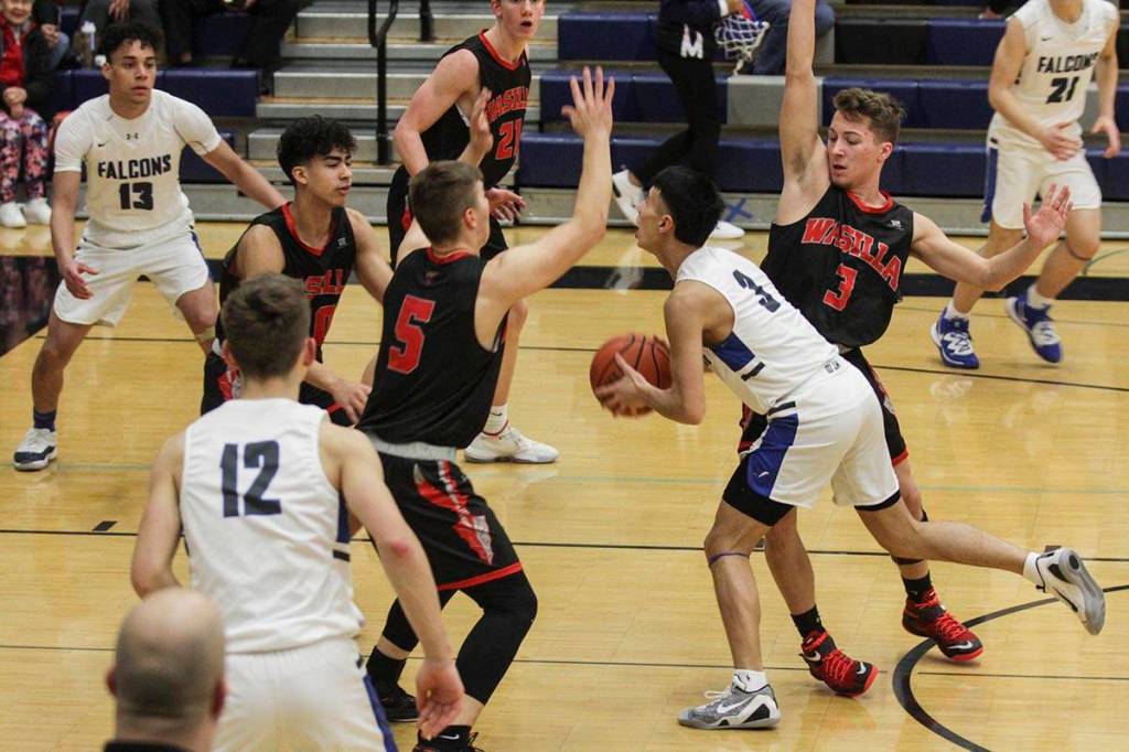 Brady Carandang advances up the the court as Thunder Mountain High School played Wasilla High School, Friday, Feb. 28, 2020. (Michael S. Lockett | Juneau Empire)