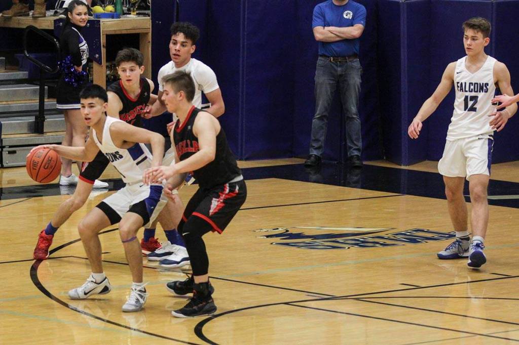 Bryson Echiverri advances up the the court as Thunder Mountain High School played Wasilla High School, Friday, Feb. 28, 2020. (Michael S. Lockett | Juneau Empire)