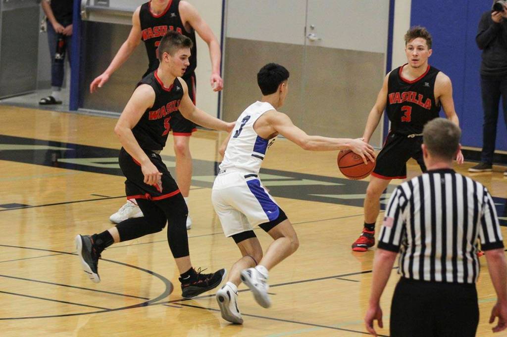 Bryson Echiverri advances up the the court as Thunder Mountain High School played Wasilla High School, Friday, Feb. 28, 2020. (Michael S. Lockett | Juneau Empire)
