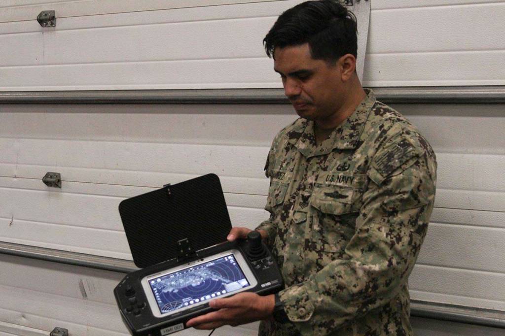 Navy Petty Officer 1st Class Juan Ramirez, an explosive ordnance disposal technician, shows the remotely operated vehicle control suite at Coast Guard Station Juneau, Feb. 29, 2020. (Michael S. Lockett | Juneau Empire)