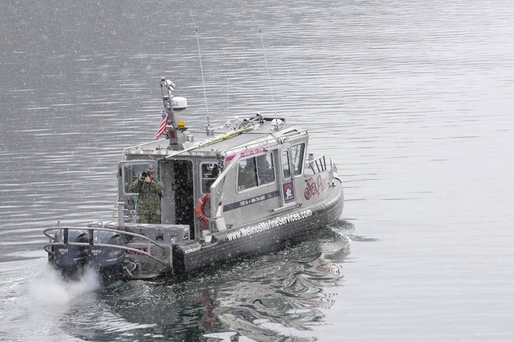 Navy sailors deploy an unmanned underwater vehicle to survey the harbor off of Coast Guard Station Juneau, Feb. 29, 2020. (Michael S. Lockett | Juneau Empire)