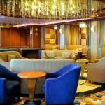 This photo provided by Michele Smith, shows an empty lounge area on the Grand Princess cruise ship Friday, March 6, 2020, off the California coast. Scrambling to keep the coronavirus at bay, officials ordered a cruise ship with about 3,500 people aboard to stay back from the California coast until passengers and crew can be tested, after a traveler from its previous voyage died of the disease and at least two others became infected. A Coast Guard helicopter lowered test kits onto the 951-foot (290-meter) Grand Princess by rope as the vessel lay at anchor off Northern California, and authorities said the results would be available on Friday, March 6, 2020. Princess Cruise Lines said fewer than 100 people aboard had been identified for testing. (Michele Smith via AP)