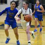 Nolin Ainsworth | Juneau Empire                                 Juneau-Douglas High School: Yadaat.at Kalés Kendyl Carson races down the floor as Bartlett High Schools Lavinia Lavelua gives chase at JDHS on Jan. 4. JDHS won 50-44.