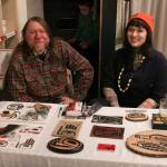 Dave Lang and Em Lang, proprieters of High Tide Tattoo, pose with some of their merchandise at Kindred Post.