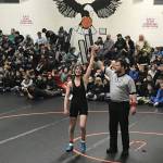 Courtesy Photos | Dana Richards                                 Above: Evelyn Richards stands with her arm raised following a match at the Middle School State Wrestling Championship in Fairbanks.