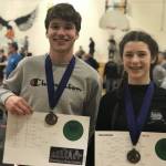 Left: Thomas Baxter, 174 pounds, and Evelyn Richard, 136 pounds, each won their divisions at the Middle School State Wrestling Championship in Fairbanks.