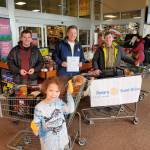 Courtesy Photo |Chris Schapp                                 Shoppers at Foodland IGA, Super Bear Supermarket IGA and Fred Meyer Juneau donated 8,320 pounds of nonperishable food for the Southeast Alaska Food Bank warehouse on March 7.