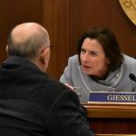 Senate President Cathy Giessel, R-Anchorage, speaks to Sen. Click Bishop, R-North Pole, on Monday, March 23, 2020. (Peter Segall | Juneau Empire)