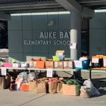 Materials for remote learning are stacked outside Auke Bay Elementary School. (Courtesy photo | Juneau School District)