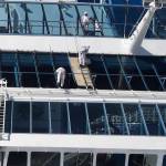 Crew members work on Oceania Cruises Sirena cruise ship docked at PortMiami, Tuesday, March 31, 2020, in Miami. (AP Photo | Wilfredo Lee)
