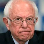 Then-Democratic presidential candidate, Sen. Bernie Sanders, I-Vt., speaks to reporters about coronavirus in Burlington, Vt. (AP Photo/Charles Krupa, File)