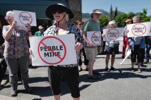 Judy Cavanaugh stands with others at a rally against the Pebble Mine in front of Sen. Lisa Murkowskis Juneau office in July 2019. (Michael Penn | Juneau Empire File)