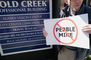 Patrick Kearney gathers for a rally against the Pebble Mine in front of Sen. Lisa Murkowskis Juneau office on Tuesday. (Michael Penn | Juneau Empire)