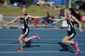 Sosan Monsef hands off the baton to teammate Sadie Tuckwood during the 2018 Alaska Track and Field State Championships. (Courtesy Photo | For JDHS Track & Field)