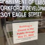 A sign on the door of the state labor department office in Anchorage, Alaska, on Friday, May 22, 2020, shows the office is closed to the public through the end of May. A report released by the department Friday showed the number of jobs in Alaska in April was down sharply compared to April 2019 amid coronavirus concerns. (AP Photo | Mark Thiessen)