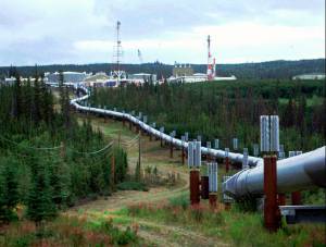 This undated file photo shows the Trans-Alaska pipeline and pump station north of Fairbanks, Alaska. The future of Alaskas unique program of paying residents an annual check is in question, with oil prices low and an economy struggling during the coronavirus pandemic. (AP Photo/Al Grillo, File)