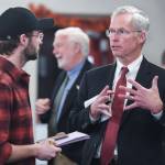 In this November 2019 photo, Jim Johnsen, president of the University of Alaska, is questioned by Kieran Poulson-Edwards, a writer for the Whalesong, the student newspaper at the University of Alaska Southeast, after Johnsens speech at the Juneau Chamber of Commerce at the Moose Lodge. (Michael Penn | Juneau Empire File)