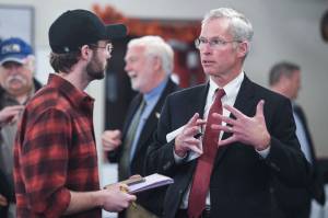 In this November 2019 photo, Jim Johnsen, president of the University of Alaska, is questioned by Kieran Poulson-Edwards, a writer for the Whalesong, the student newspaper at the University of Alaska Southeast, after Johnsens speech at the Juneau Chamber of Commerce at the Moose Lodge. (Michael Penn | Juneau Empire File)