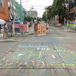 A sign on the street reads Welcome to the CHOP, Saturday, June 20, 2020, inside what has been named the Capitol Hill Occupied Protest zone in Seattle. A pre-dawn shooting near the area left one person dead and critically injured another person, authorities said Saturday. The area has been occupied by protesters after Seattle Police pulled back from several blocks of the citys Capitol Hill neighborhood near the Police Departments East Precinct building. (AP Photo/Ted S. Warren)