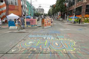A sign on the street reads Welcome to the CHOP, Saturday, June 20, 2020, inside what has been named the Capitol Hill Occupied Protest zone in Seattle. A pre-dawn shooting near the area left one person dead and critically injured another person, authorities said Saturday. The area has been occupied by protesters after Seattle Police pulled back from several blocks of the citys Capitol Hill neighborhood near the Police Departments East Precinct building. (AP Photo/Ted S. Warren)