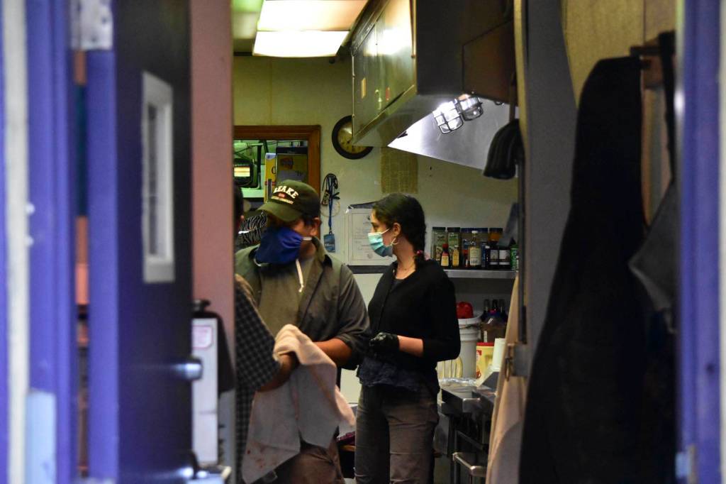 Staff at the Glory Hall prepare meals, the only source of food for many Juneau residents experiencing homelessness, June 25, 2020. Executive Director Mariya Lovishchuk said that this is leading to friction with downtown residents and businesses, and supports the Juneau Cares program, a program that pays local restaurants to help feed the homeless or food-insecure. (Juneau Empire | Peter Segall)