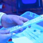 Capital City Fire/Rescue firefighter/paramedic Wendy Wallers holds up a testing kit at the citys drive-through Covid-19 testing site at the William A. Hagevig Regional Fire Training Center on Monday, June 29, 2020. (Peter Segall | Juneau Empire)