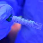 Capital City Fire/Rescue firefighter/EMT Jessica Skiba holds a COVID-19 test sample at the citys drive-thru screening site at the Hagevig Regional Fire Training Center in the Mendenhall Valley on Monday, June 29, 2020. (Peter Segall | Juneau Empire)
