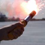 A signal flare burns bright enough to light up the day lit shores of the Sacramento Delta during a flare training exercise held at Coast Guard Station Rio Vista, Friday, April 6, 2012. (Courtesy Photo | Petty Officer 2nd Class Levi Read)