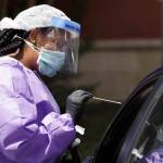 Liza Collins, a travel nurse from Ville Platte, La., administers a COVID-19 test at the Rutherford County Health Department, Thursday, July 2, 2020, in Murfreesboro, Tenn. Tennessee Gov. Bill Lee issued a stern warning to the public Wednesday as Tennessee registered its highest daily increase in positive COVID-19 tests for the third time in a week and a half. (AP Photo | Mark Humphrey)