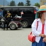 Suzanne Haight dons a hat and face covering in the parade staging area prior to a parade Saturday, July 4, 2020. (Ben Hohenstatt | Juneau Empire)
