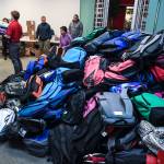 This July 2019 photo shows some of over 2,000 backpacks that were given away to students throughout Southeast Alaska through Tlingit and Haidas Temporary Assistance For Needy Families Department. This year in order to help accommodate virtual learning, when backpacks are distributed, they will come with Google Chromebooks. (Michael Penn | Juneau Empire File)