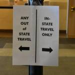 A sign at the Juneau International Airport on Tuesday, July 28, 2020, guiding arriving passengers through the correct stations for paperwork checks and screening. Nonresident out-of-state arrivals will have to provide negative COVID-19-test results upon arrival under a revised travel mandate from Gov. Mike Dunleavy. (Peter Segall / Juneau Empire)