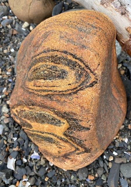 The profile of a mustached person on a golden rock on a North Douglas Beach in this July 24, 2020 photo. (Courtesy Photo / Denise Carroll)