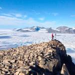 Luke Copland This July 2015 photo taken by University of Ottawa glaciology professor Luke Copland shows Canadian Ice Service ice analyst Adrienne White taking a photo of cracks of the Milne Ice Shelf, which just broke apart.