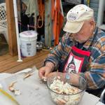 Mickey Prescott picks crab meat at Mickeys Fishcamp. (Vivian Faith Prescott / For the Capital City Weekly)