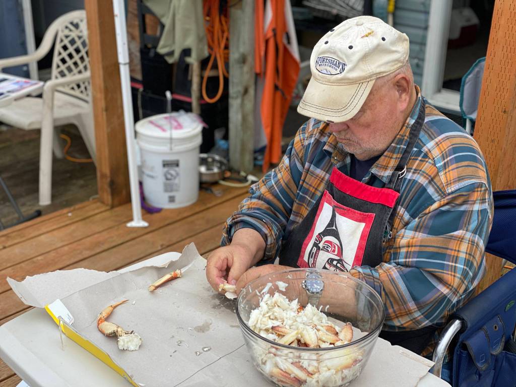 Mickey Prescott picks crab meat at Mickeys Fishcamp. (Vivian Faith Prescott / For the Capital City Weekly)