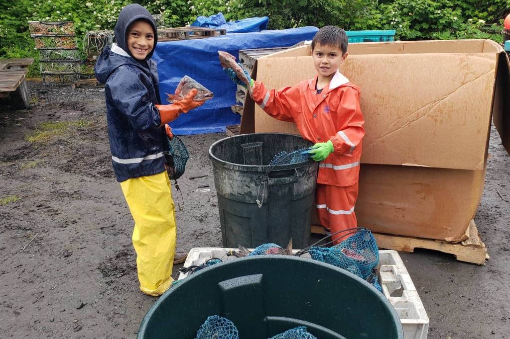 Owen Mork and Chatham Mork bait up for the crabbing season. (Courtesy Photo / Mitch Mork)