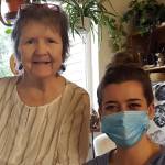 Carol OGara, left, sits with volunteer Madeline Kauffman during one of their weekly visits. Volunteers provide a number of services of seniors, including providing them company. (Courtesy photo / Catholic Community Services)