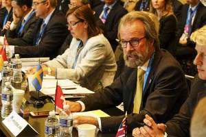 Konrad Steffen, wears glasses and a yellow tie, at the White House in 2016, where he represented Switzerland at the first Arctic Ministerial Conference. (Courtesy Photo / Swiss Federal Institute for Forest, Snow and Landscape)