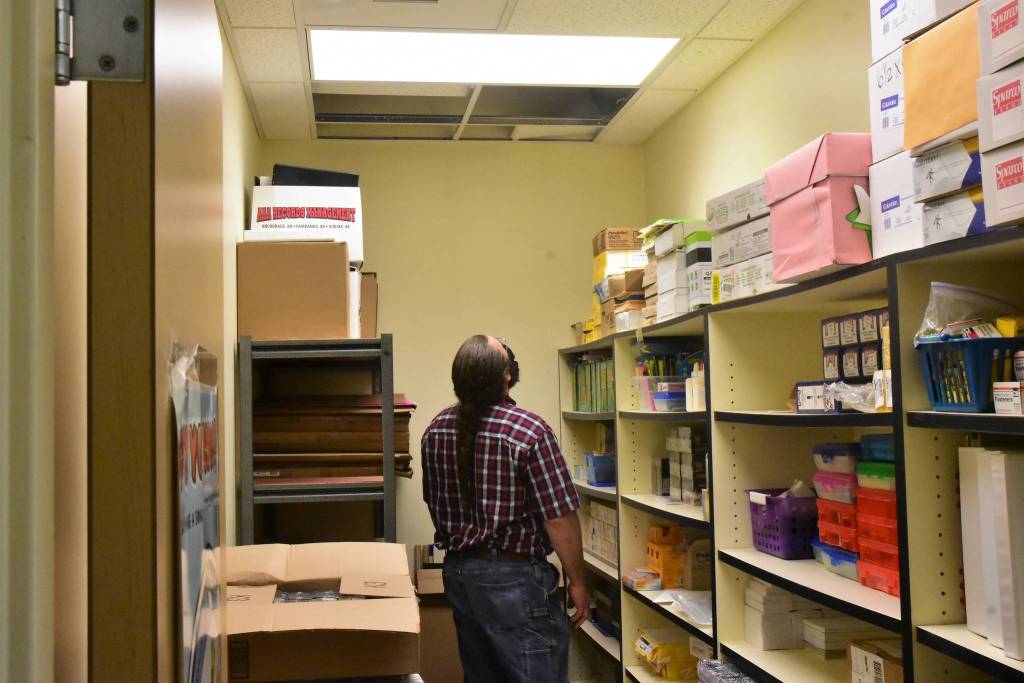 Peter Segall / Juneau Empire                                Juneau School District Maintenance Supervisor Dan Bryant inspects a portion of the ceiling at Riverbend Elementary School on Friday, Aug. 21, 2020. Riverbends roof has had issues since its construction, Bryant said, and leaks in various places throughout the school.