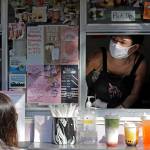 Kaye Fan, right, calls out orders as she works in her Dreamy Drinks food truck, Monday, Aug. 10, 2020, near the suburb of Lynnwood, Wash., north of Seattle. Long seen as a feature of city living, food trucks are now finding customers in the suburbs during the coronavirus pandemic as people are working and spending most of their time at home. (AP Photo / Ted S. Warren)