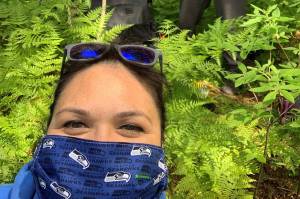 Maleah Wenzel, Heather Powell and Vivian Mork harvest devils club in Juneau amid a pandemic. (Courtesy Photo / Heather Powell)