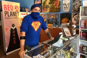 This Aug. 19, 2020, image shows Aaron Cuffee of Red Planet Books & Comics in Albuquerque, N.M., as he discusses the potential that could come from Marvel Comics effort to assemble a gallery of Native artists and scribes for Marvel Voices: Indigenous Voices #1. The anthology will revisit some of Marvels Native characters. (AP Photo / Susan Montoya Bryan)