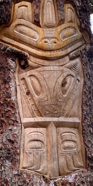 This photo shows Northwest Coast art carved into a tree near the top of the Goldbelt Mount Roberts Tram building. (Courtesy Photo / Denise Carroll)